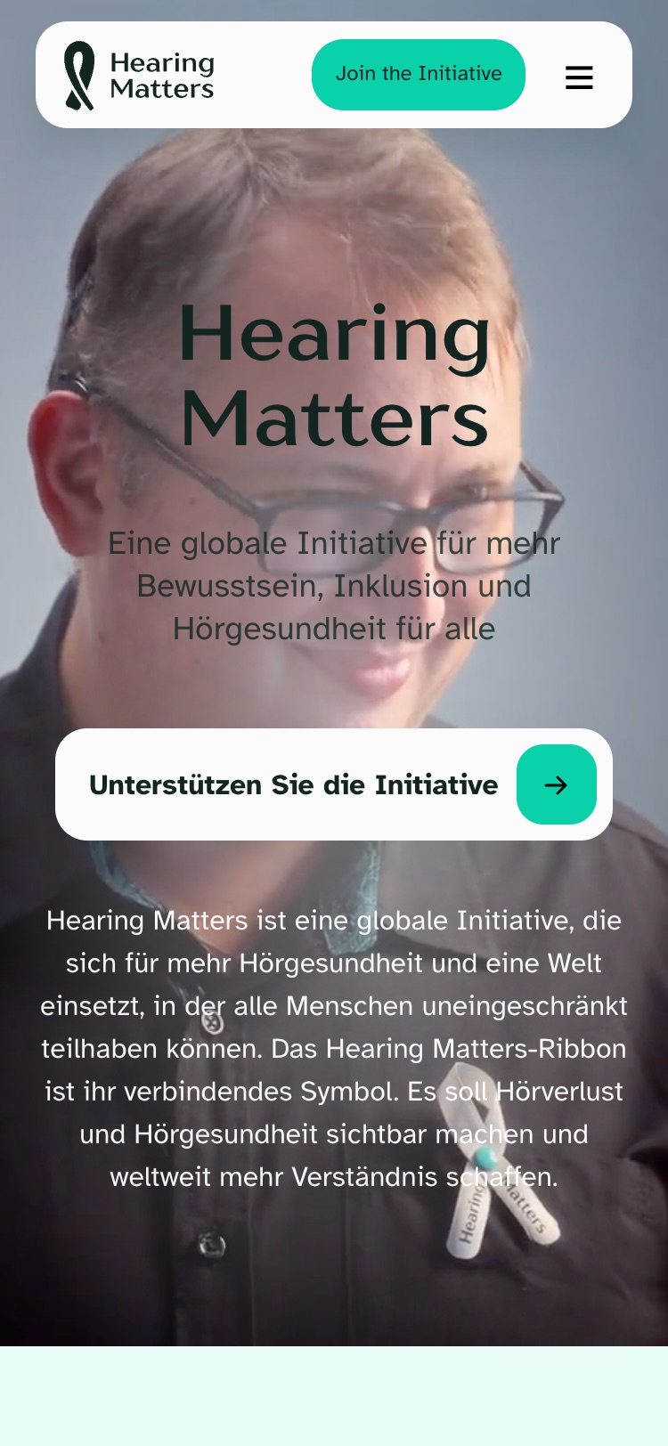 The Hearing Matters homepage at 375 pixels wide, hero over video.